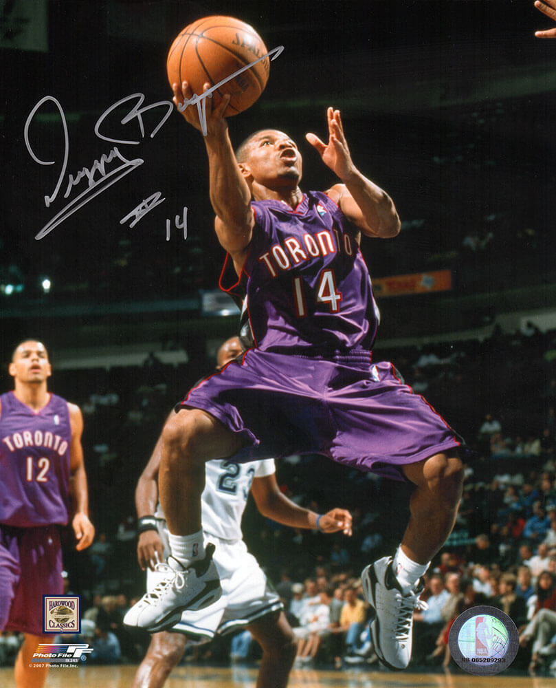 Muggsy Bogues Signed Toronto Raptors Purple Jersey Action 8x10 Photo - BOU08P200 - Muggsy Bogues Signed Toronto Raptors Purple Jersey Action 8x10 Photo product image