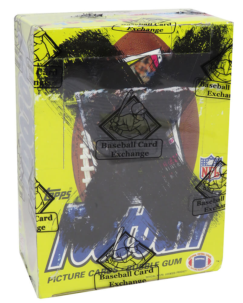 1984 Topps Football Unopened Wax (X-Out) Box BBCE Sealed Wrapped - 36 Packs (John Elway, Dan Marino RC??)(A) - BX384TWEA - 1984 Topps Football Unopened Wax (X-Out) Box BBCE Sealed Wrapped - 36 Packs (John Elway, Dan Marino RC??)(A) product image