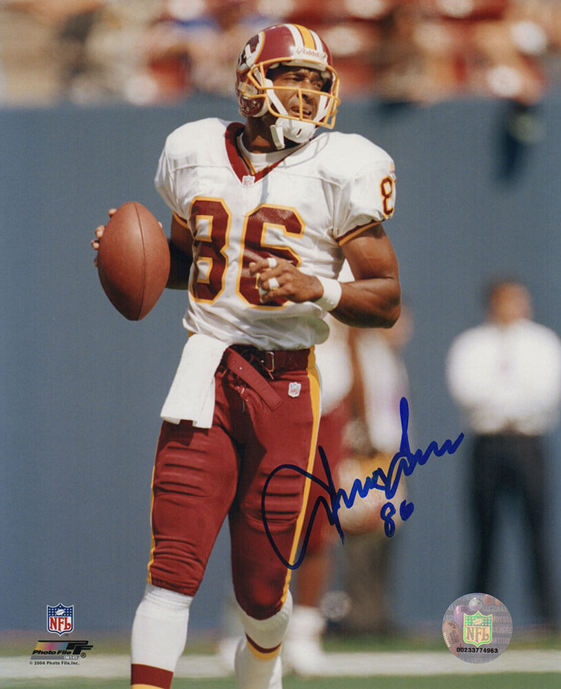 Irving Fryar Signed Washington Football Team White Jersey With Football 8x10 Photo - FRY08P304 - Irving Fryar Signed Washington Football Team White Jersey With Football 8x10 Photo product image