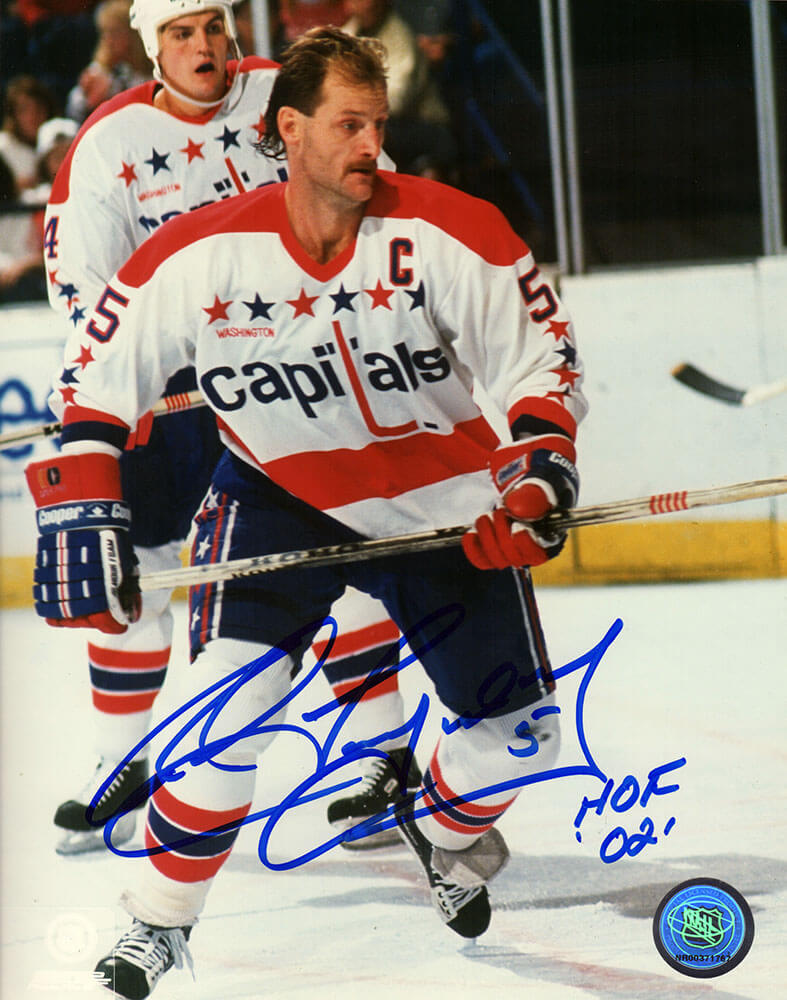 Rod Langway Signed Capitals White Jersey Holding Stick Action 8x10 Photo w/HOF'02 - LAN08P400 - Rod Langway Signed Capitals White Jersey Holding Stick Action 8x10 Photo w/HOF'02 product image