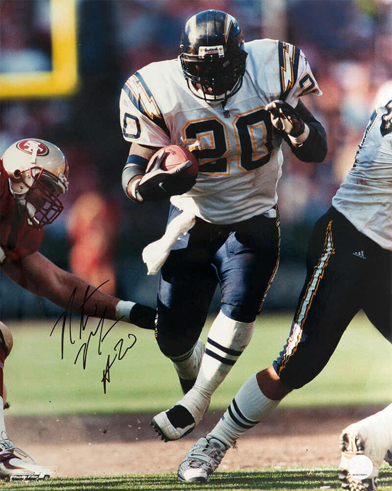 Natrone Means Signed Chargers White Jersey With Football vs 49ers Action 16x20 Photo - MEA16P300 - Natrone Means Signed Chargers White Jersey With Football vs 49ers Action 16x20 Photo product image