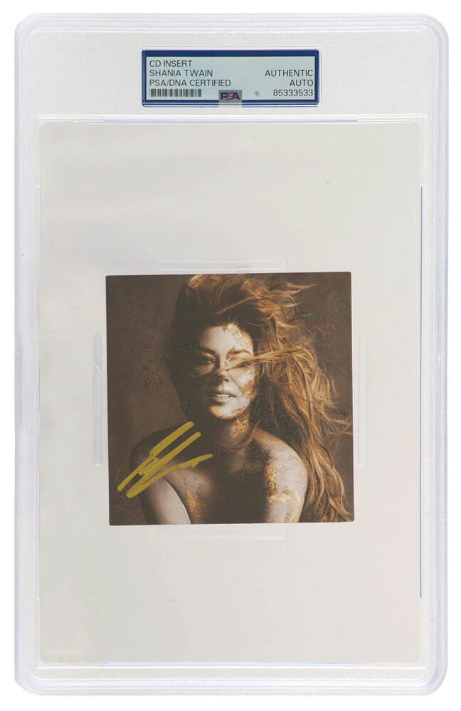 Shania Twain Signed 'Queen Of Me' 4x4 CD Insert (In Gold) - (PSA/DNA Encapsulated) - TWACUT501 - Shania Twain Signed 'Queen Of Me' 4x4 CD Insert (In Gold) - (PSA/DNA Encapsulated) product image