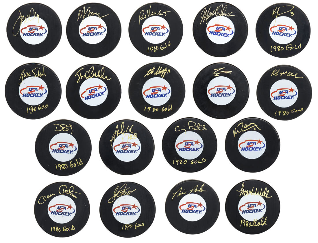 1980 USA Hockey 'Miracle On Ice' Team Signed Individual USA Hockey Logo Hockey Puck Set (18 - Pucks) - USAPUC401 - 1980 USA Hockey 'Miracle On Ice' Team Signed Individual USA Hockey Logo Hockey Puck Set (18 - Pucks) product image