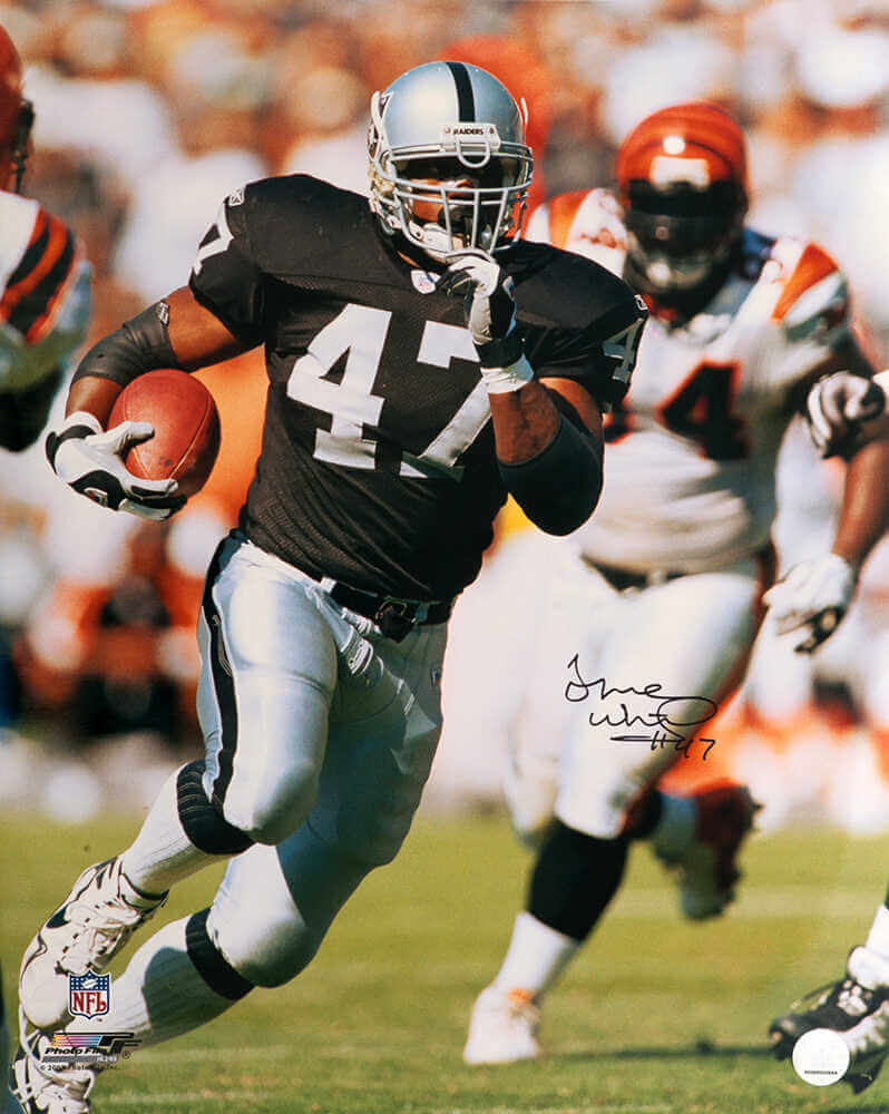 Tyrone Wheatley Signed Raiders Black Jersey Action 16x20 Photo - WHE16P301 - Tyrone Wheatley Signed Raiders Black Jersey Action 16x20 Photo product image